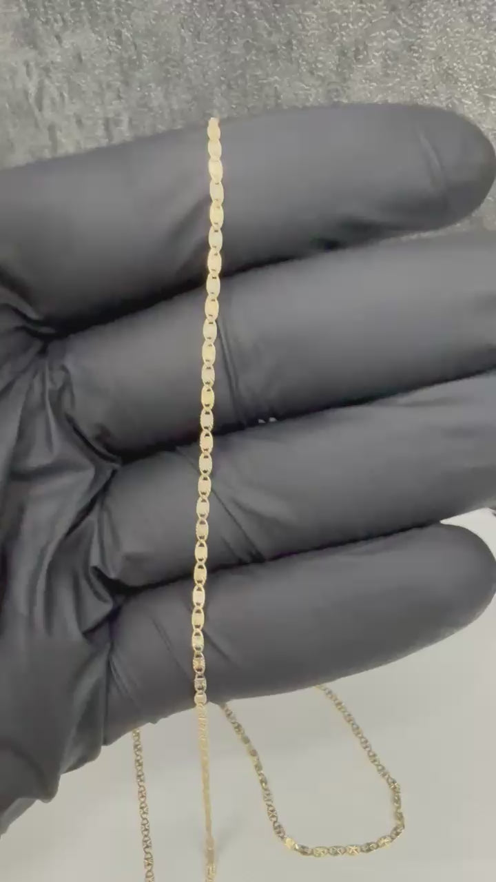 Two-tone 10K gold Valentino-style chain and a woman's ring